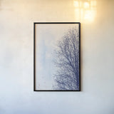 Blue Tree by Deborah Revell. shown as a paper print in a black flame. Available as a archival giclee rolled canvas, fine art paper, or poster print. SKU 90973h.
