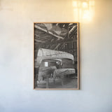 Canoe Barn by Deborah Revell. shown as a paper print in a natural frame. Available as a archival giclee rolled canvas, fine art paper, or poster print. SKU 96600h.