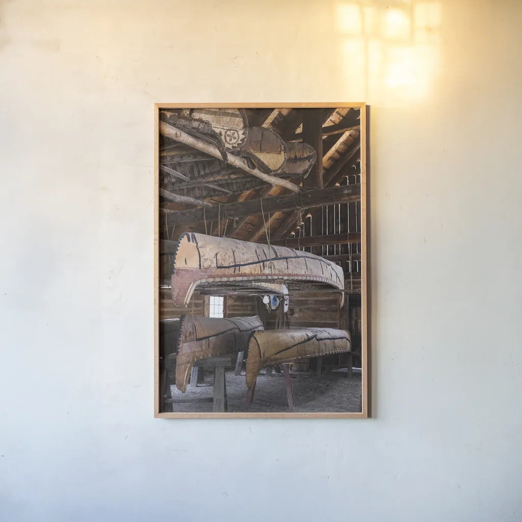 Canoe Barn II by Deborah Revell. shown as a paper print in a natural frame. Available as a archival giclee rolled canvas, fine art paper, or poster print. SKU 99670h.