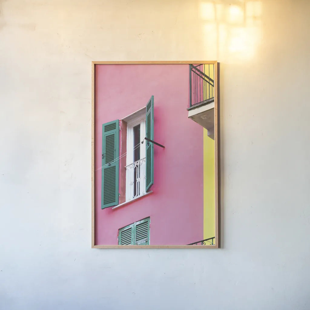 Cinque Terre Pink by Deborah Revell. shown as a paper print in a natural frame. Available as a archival giclee rolled canvas, fine art paper, or poster print. SKU 95016h.