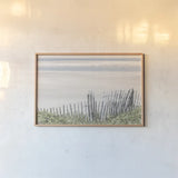 Coastal Fence I by Deborah Revell. shown as a paper print in a natural frame. Available as a archival giclee rolled canvas, fine art paper, or poster print. SKU 102392i.