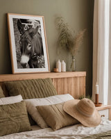 Cottage Donkey III by Deborah Revell. shown as a paper print in a natural frame. Available as a archival giclee rolled canvas, fine art paper, or poster print. SKU 100061h.