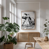 Cycle II by Deborah Revell. shown as a print in a natural wood frame in a dining room. Available as a archival giclee rolled canvas, fine art paper, or poster print. SKU 104307h.