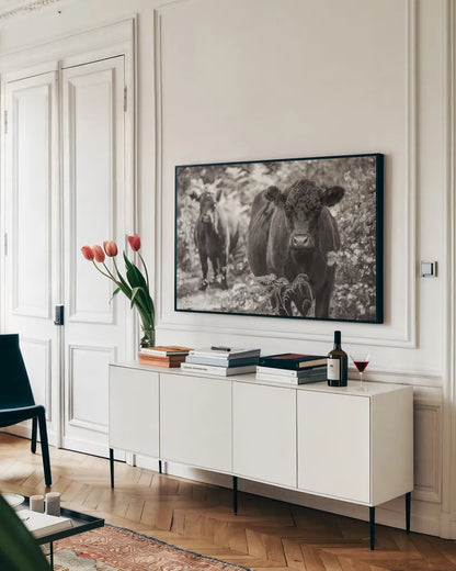 Dartmoor Cattle  by Deborah Revell. shown as a framed stretched canvas in a living room above a console. Available as a archival giclee rolled canvas, fine art paper, or poster print. SKU 94284i.