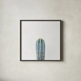 Desert Treasures III by Deborah Revell. Shown in a sleek black glass frame for a contemporary gallery look. Available as an archival giclee rolled canvas, fine art paper, or poster print. SKU 94581a.