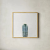 Desert Treasures III by Deborah Revell. Shown in a natural wood glass frame for a timeless modern aesthetic. Available as an archival giclee rolled canvas, fine art paper, or poster print. SKU 94581a.
