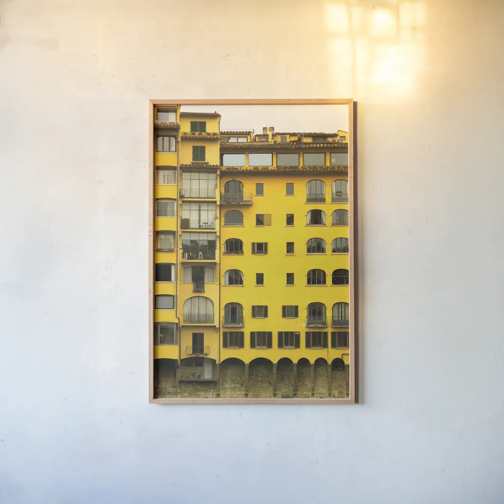 Florence Yellow by Deborah Revell. shown as a paper print in a natural frame. Available as a archival giclee rolled canvas, fine art paper, or poster print. SKU 95015h.