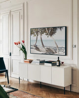 Fort Zachary Beach II by Deborah Revell. shown as a framed stretched canvas in a living room above a console. Available as a archival giclee rolled canvas, fine art paper, or poster print. SKU 103789i.