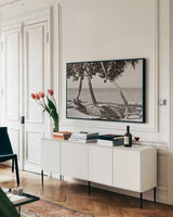 Fort Zachary Beach II BW by Deborah Revell. shown as a framed stretched canvas in a living room above a console. Available as a archival giclee rolled canvas, fine art paper, or poster print. SKU 103790i.