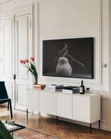 Frans Pumpkin II by Deborah Revell. shown as a framed stretched canvas in a living room above a console. Available as a archival giclee rolled canvas, fine art paper, or poster print. SKU 102840i.