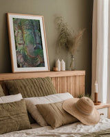 Ganesha Statue by Deborah Revell. shown as a paper print in a natural frame. Available as a archival giclee rolled canvas, fine art paper, or poster print. SKU 94002h.