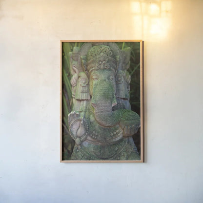 Ganesha Statue by Deborah Revell. shown as a paper print in a natural frame. Available as a archival giclee rolled canvas, fine art paper, or poster print. SKU 94002h.