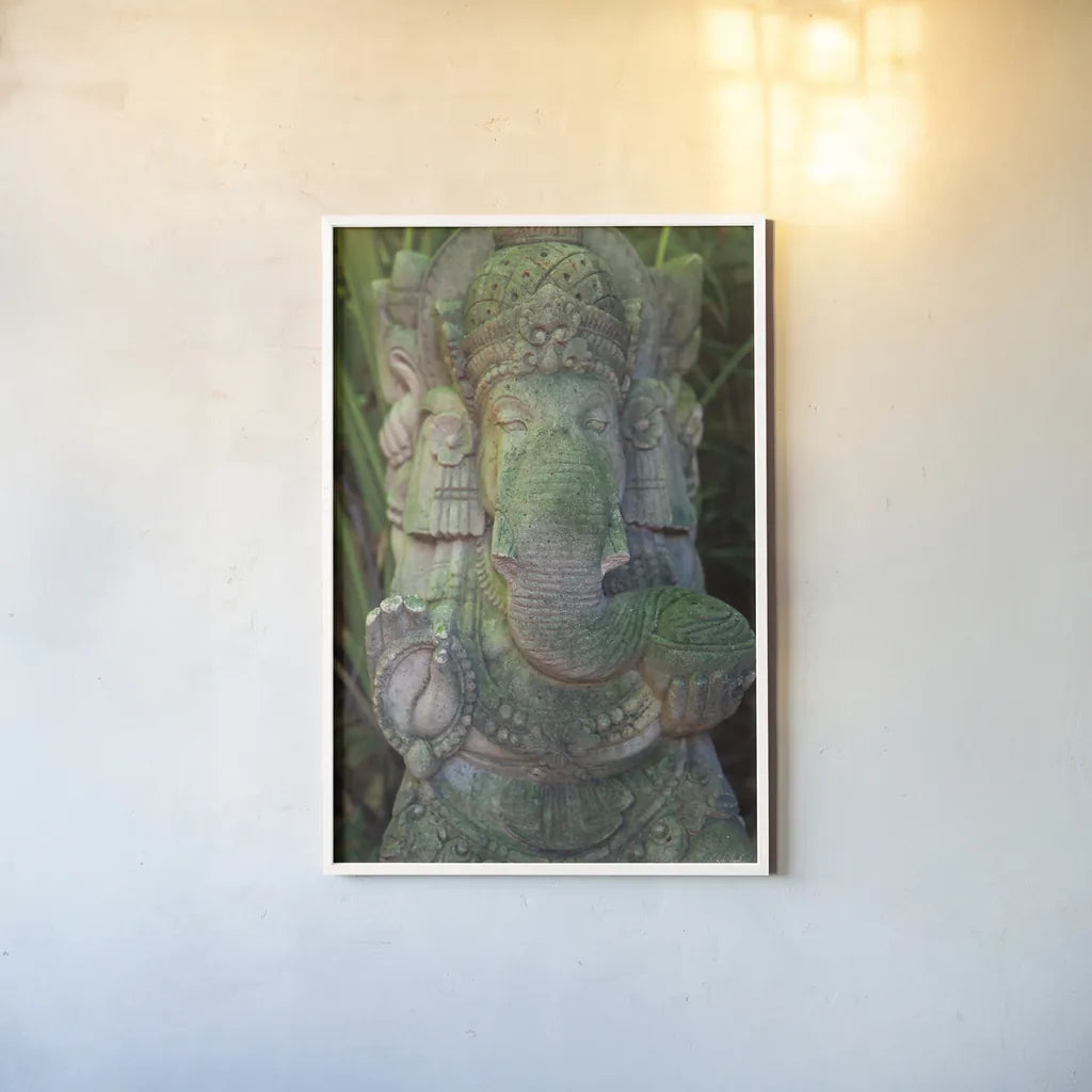 Ganesha Statue by Deborah Revell. shown as a paper print in a white frame. Available as a archival giclee rolled canvas, fine art paper, or poster print. SKU 94002h.