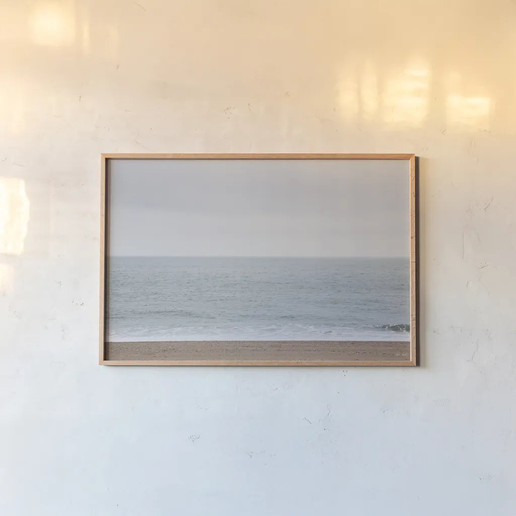 Gentle Sea I by Deborah Revell. shown as a paper print in a natural frame. Available as a archival giclee rolled canvas, fine art paper, or poster print. SKU 100317i.