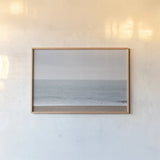 Gentle Sea I by Deborah Revell. shown as a paper print in a natural frame. Available as a archival giclee rolled canvas, fine art paper, or poster print. SKU 100317i.