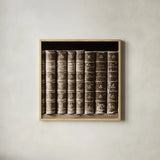 History Books III by Deborah Revell. Shown in a natural wood glass frame for a timeless modern aesthetic. Available as an archival giclee rolled canvas, fine art paper, or poster print. SKU 96918a.