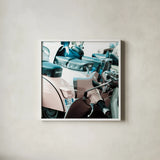 Italian Scooter I by Deborah Revell. Shown in a crisp white glass frame for a clean and minimalist style. Available as an archival giclee rolled canvas, fine art paper, or poster print. SKU 91132a.