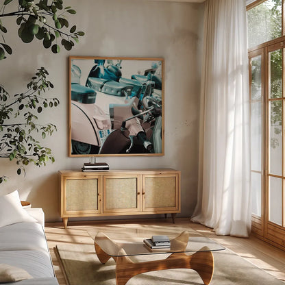 Italian Scooter I by Deborah Revell. Shown in a natural wood frame in a cozy modern living room. Available as an archival giclee rolled canvas, fine art paper, or poster print. SKU 91132a.