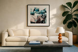 Italian Scooter I by Deborah Revell. Displayed in a glass frame with matte in a clean modern living room. Available as an archival giclee rolled canvas, fine art paper, or poster print. SKU 91132a.