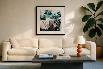 Italian Scooter I by Deborah Revell. Displayed in a glass frame with matte in a clean modern living room. Available as an archival giclee rolled canvas, fine art paper, or poster print. SKU 91132a.