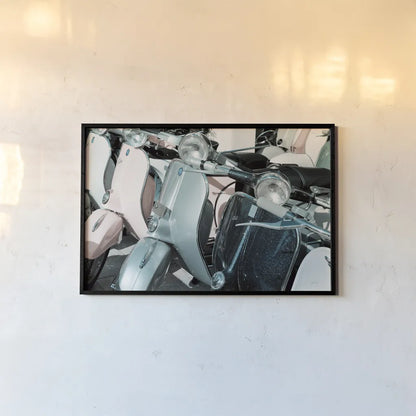 Italian Scooter III by Deborah Revell. shown as a paper print in a black flame. Available as a archival giclee rolled canvas, fine art paper, or poster print. SKU 91134i.