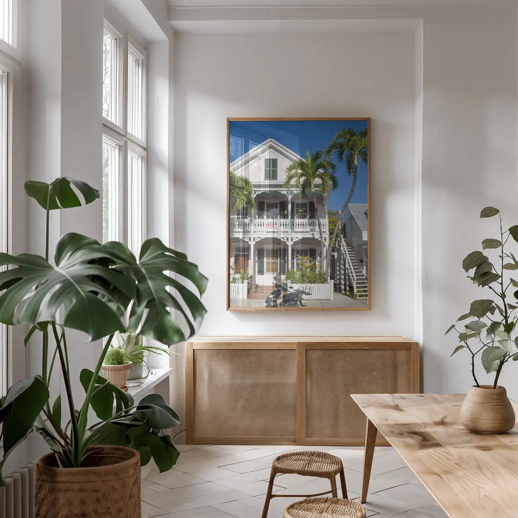 Key West by Deborah Revell. shown as a print in a natural wood frame in a dining room. Available as a archival giclee rolled canvas, fine art paper, or poster print. SKU 94192h.