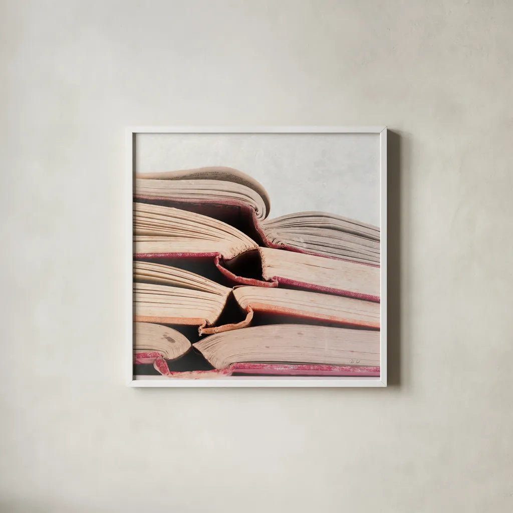 Livres Rouge by Deborah Revell. Shown in a crisp white glass frame for a clean and minimalist style. Available as an archival giclee rolled canvas, fine art paper, or poster print. SKU 96920a.