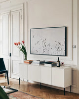 Meadow Grass III by Deborah Revell. shown as a framed stretched canvas in a living room above a console. Available as a archival giclee rolled canvas, fine art paper, or poster print. SKU 93438i.