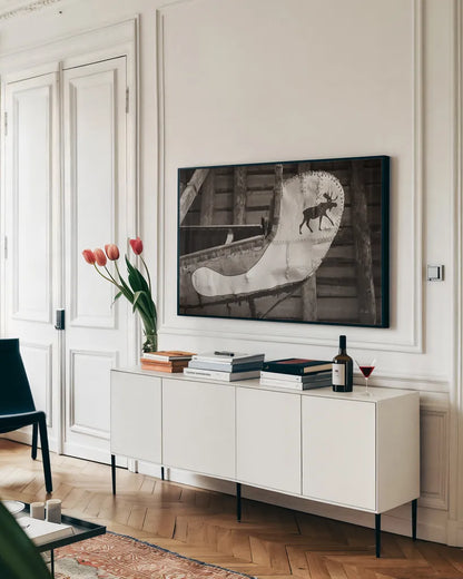 Moose Canoe by Deborah Revell. shown as a framed stretched canvas in a living room above a console. Available as a archival giclee rolled canvas, fine art paper, or poster print. SKU 96602i.