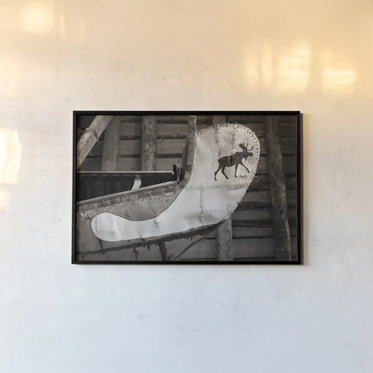 Moose Canoe by Deborah Revell. shown as a paper print in a black flame. Available as a archival giclee rolled canvas, fine art paper, or poster print. SKU 96602i.