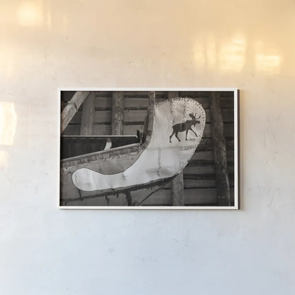 Moose Canoe by Deborah Revell. shown as a paper print in a white frame. Available as a archival giclee rolled canvas, fine art paper, or poster print. SKU 96602i.