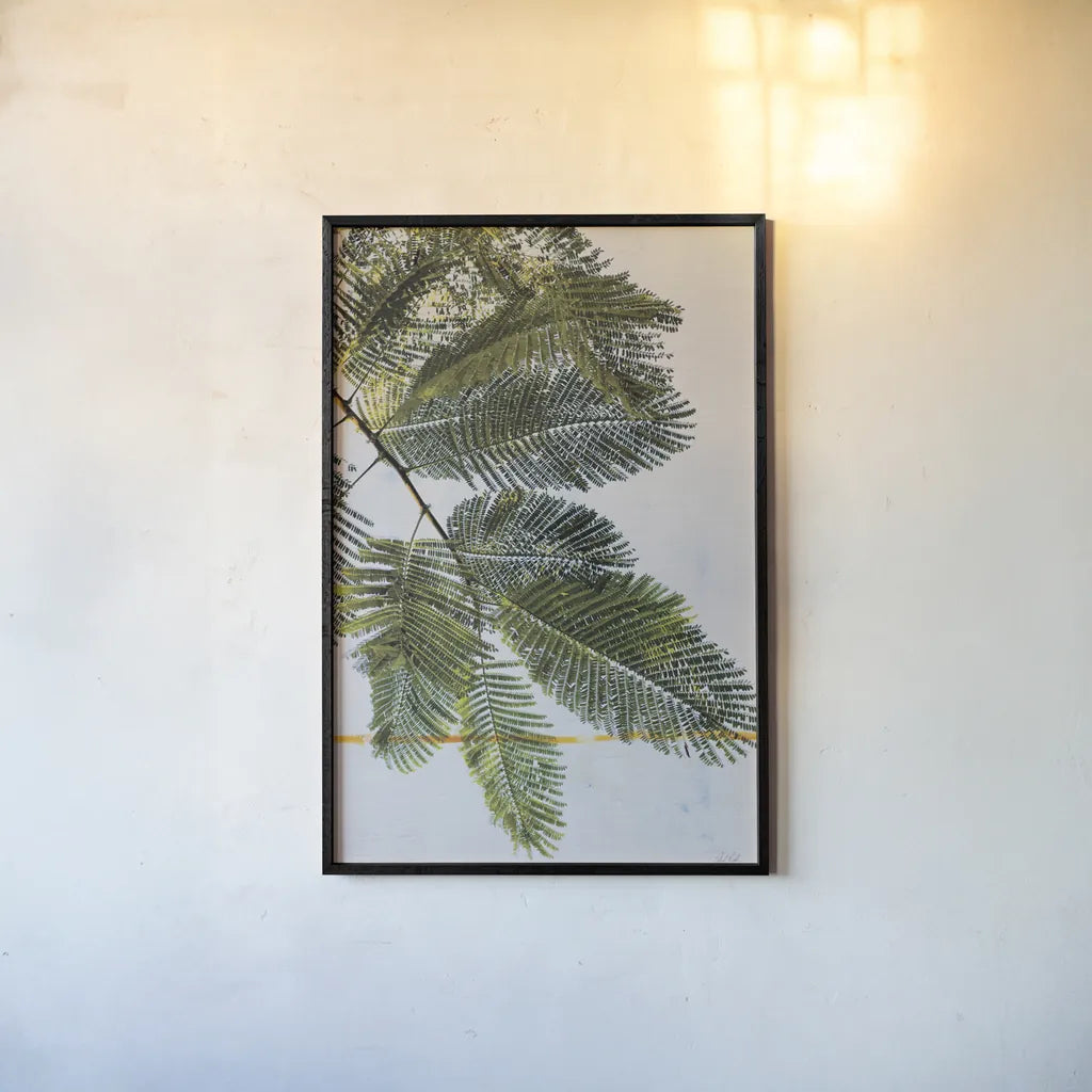 Palm Branch by Deborah Revell. shown as a paper print in a black flame. Available as a archival giclee rolled canvas, fine art paper, or poster print. SKU 91855h.