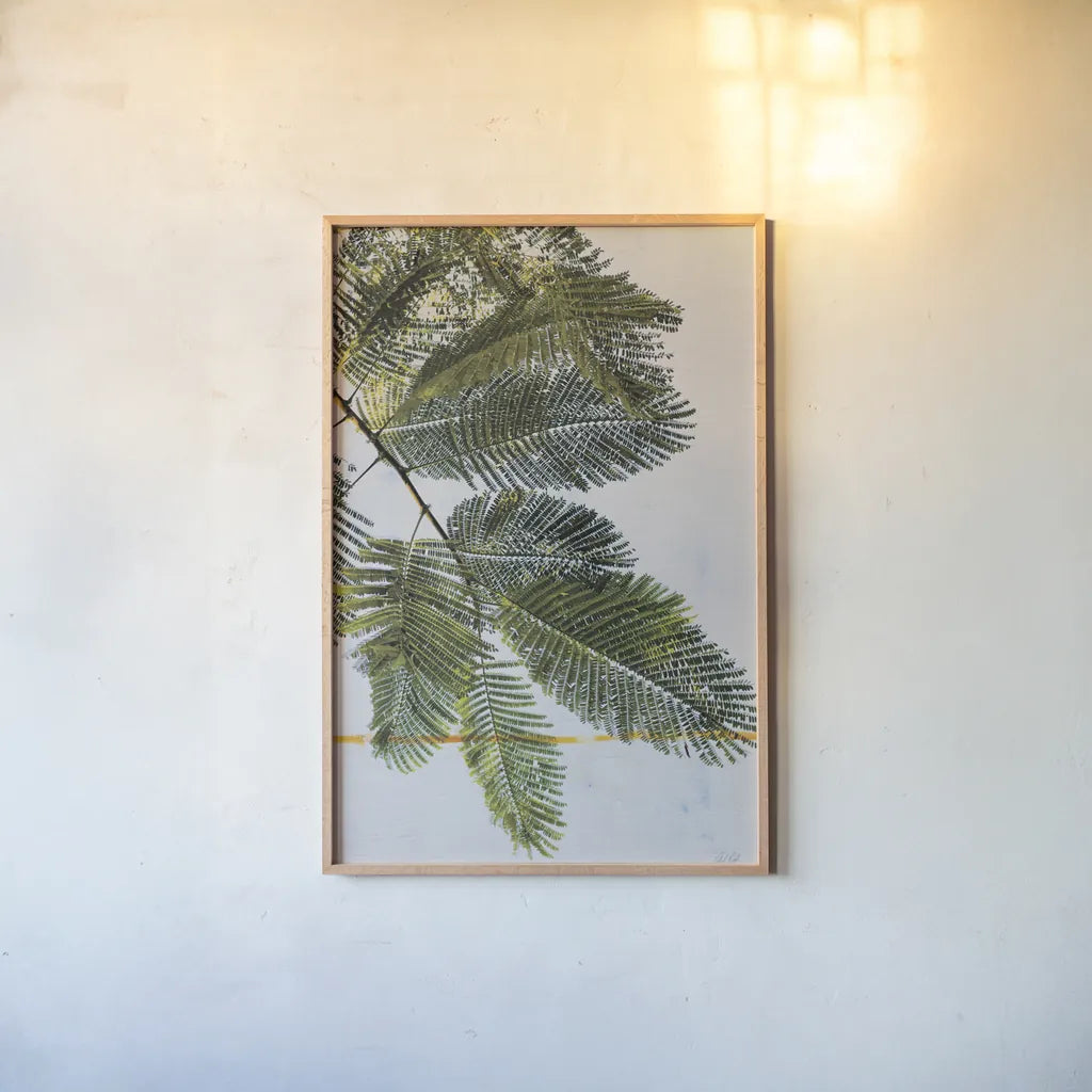 Palm Branch by Deborah Revell. shown as a paper print in a natural frame. Available as a archival giclee rolled canvas, fine art paper, or poster print. SKU 91855h.