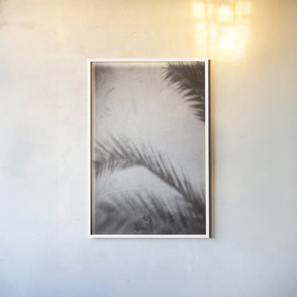 Palm Shadow Afternoon I by Deborah Revell. shown as a paper print in a white frame. Available as a archival giclee rolled canvas, fine art paper, or poster print. SKU 94352h.