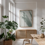 Palm Shadow I by Deborah Revell. shown as a print in a natural wood frame in a dining room. Available as a archival giclee rolled canvas, fine art paper, or poster print. SKU 94354h.