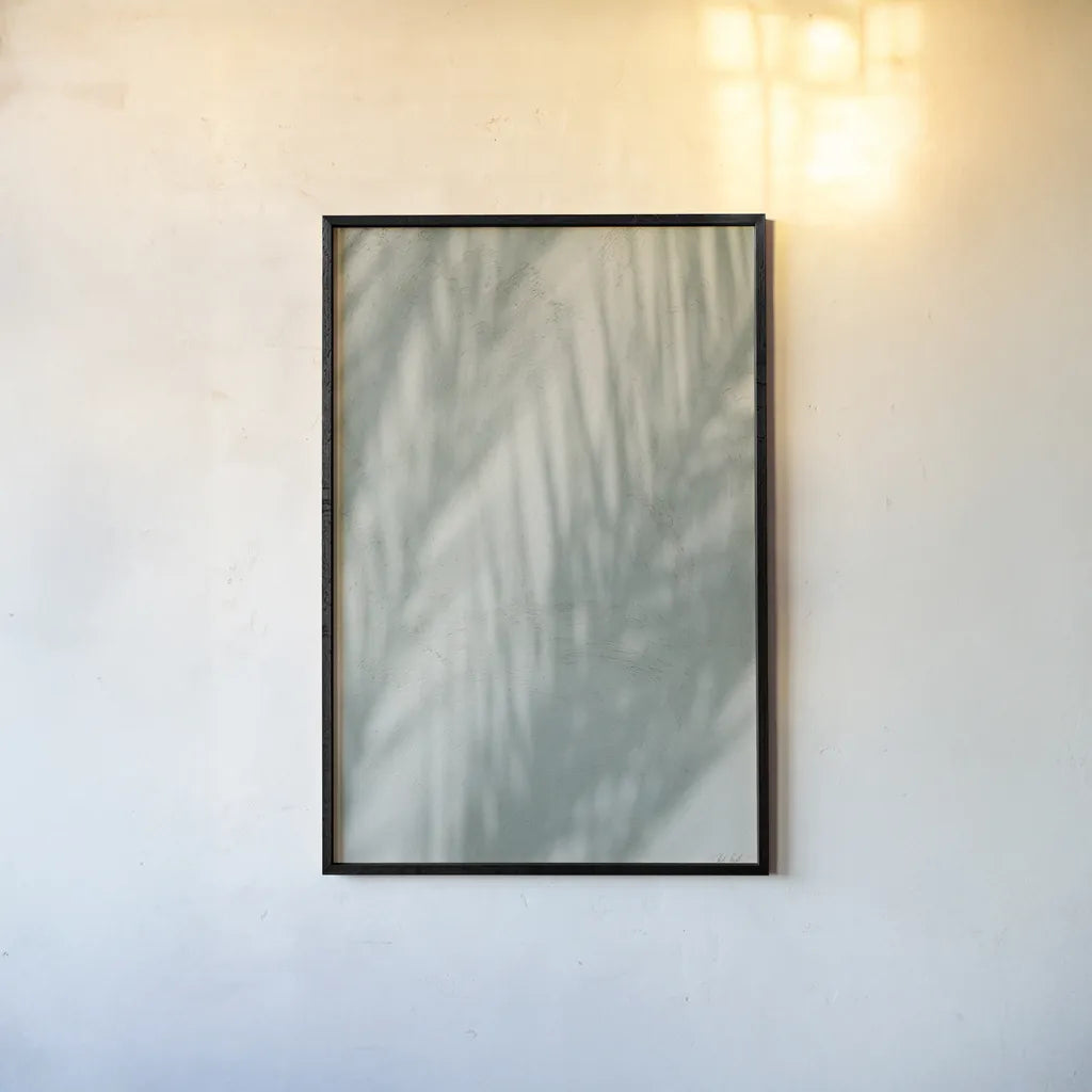Palm Shadow III by Deborah Revell. shown as a paper print in a black flame. Available as a archival giclee rolled canvas, fine art paper, or poster print. SKU 94356h.