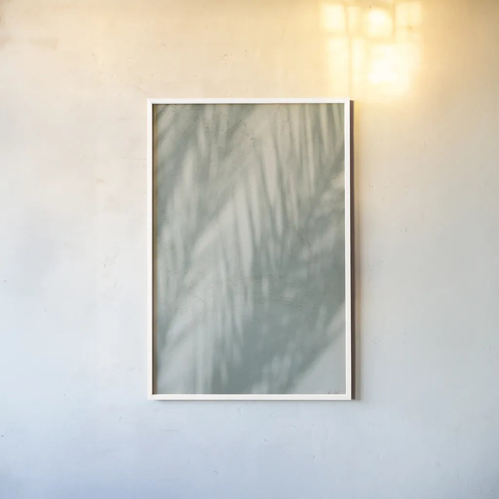 Palm Shadow III by Deborah Revell. shown as a paper print in a white frame. Available as a archival giclee rolled canvas, fine art paper, or poster print. SKU 94356h.