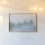 Palms in the Mist II by Deborah Revell. shown as a paper print in a natural frame. Available as a archival giclee rolled canvas, fine art paper, or poster print. SKU 104907i.