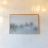 Palms in the Mist III by Deborah Revell. shown as a paper print in a natural frame. Available as a archival giclee rolled canvas, fine art paper, or poster print. SKU 104908i.