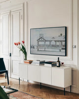 Pier III by Deborah Revell. shown as a framed stretched canvas in a living room above a console. Available as a archival giclee rolled canvas, fine art paper, or poster print. SKU 91626i.