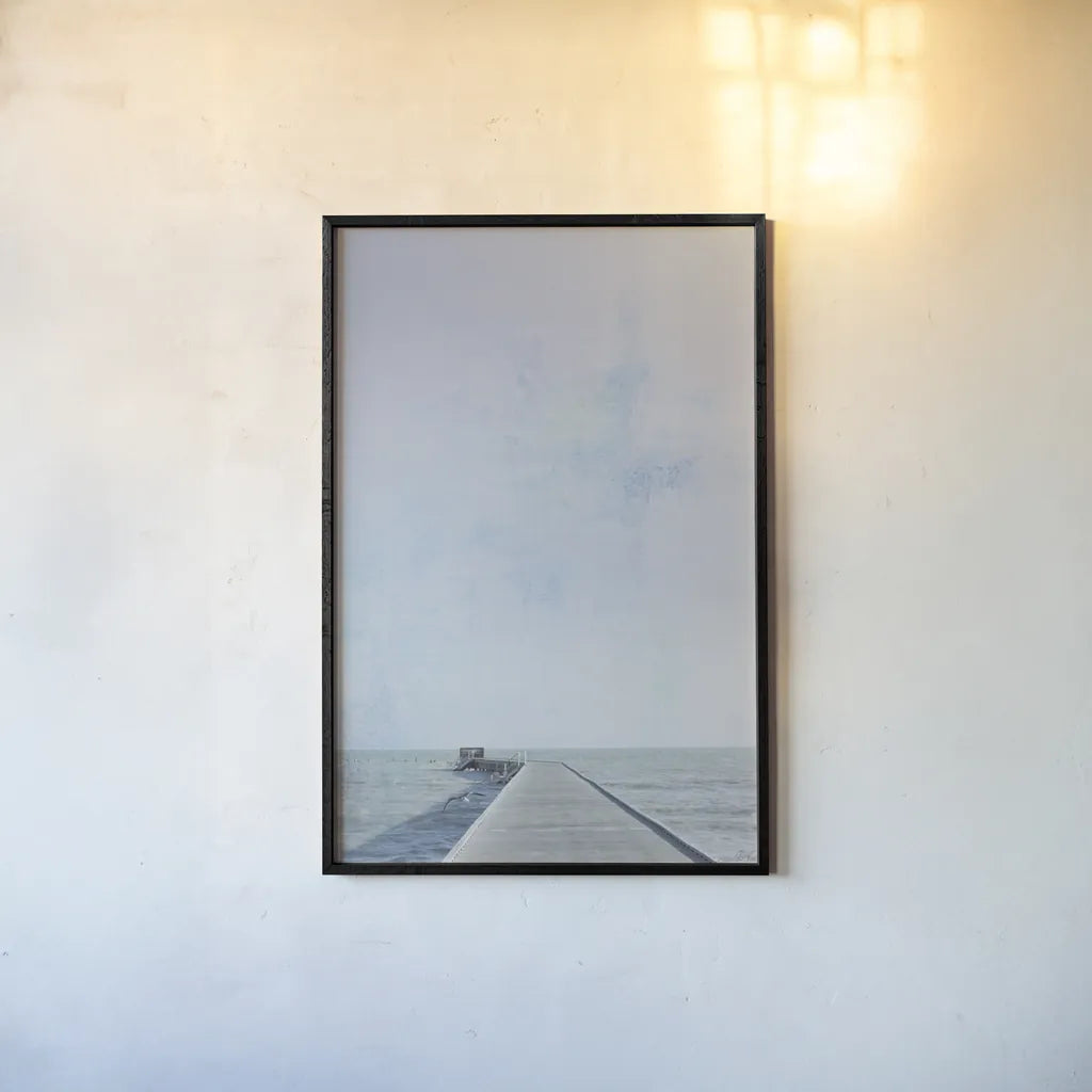 Pier V by Deborah Revell. shown as a paper print in a black flame. Available as a archival giclee rolled canvas, fine art paper, or poster print. SKU 91628h.