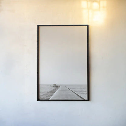 Pier V Sepia by Deborah Revell. shown as a paper print in a black flame. Available as a archival giclee rolled canvas, fine art paper, or poster print. SKU 95312h.