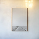 Pier V Sepia by Deborah Revell. shown as a paper print in a natural frame. Available as a archival giclee rolled canvas, fine art paper, or poster print. SKU 95312h.