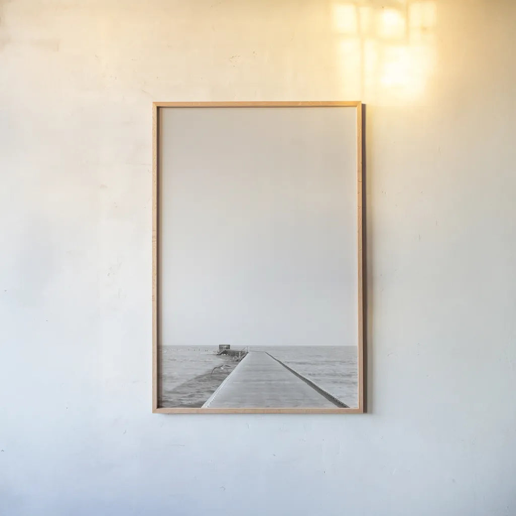 Pier V Sepia by Deborah Revell. shown as a paper print in a natural frame. Available as a archival giclee rolled canvas, fine art paper, or poster print. SKU 95312h.