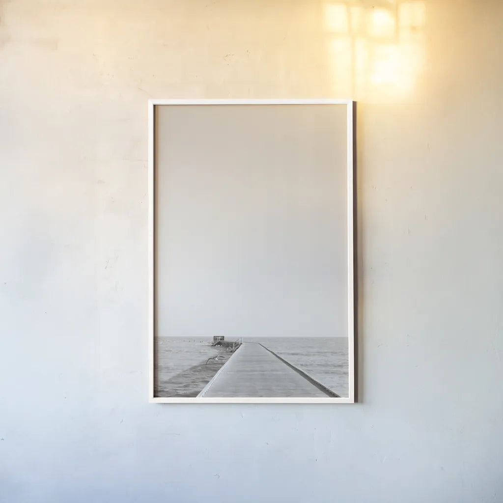 Pier V Sepia by Deborah Revell. shown as a paper print in a white frame. Available as a archival giclee rolled canvas, fine art paper, or poster print. SKU 95312h.