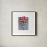 Pink Hydrangea on Book by Deborah Revell. Shown in a sleek black glass frame for a contemporary gallery look. Available as an archival giclee rolled canvas, fine art paper, or poster print. SKU 98517a.