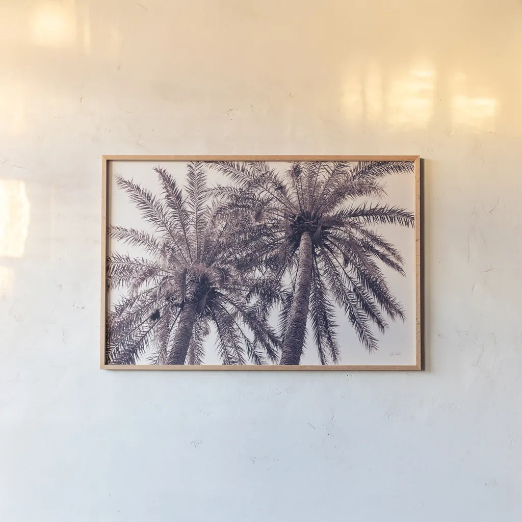 Pink Palms Horizontal by Deborah Revell. shown as a paper print in a natural frame. Available as a archival giclee rolled canvas, fine art paper, or poster print. SKU 94378i.