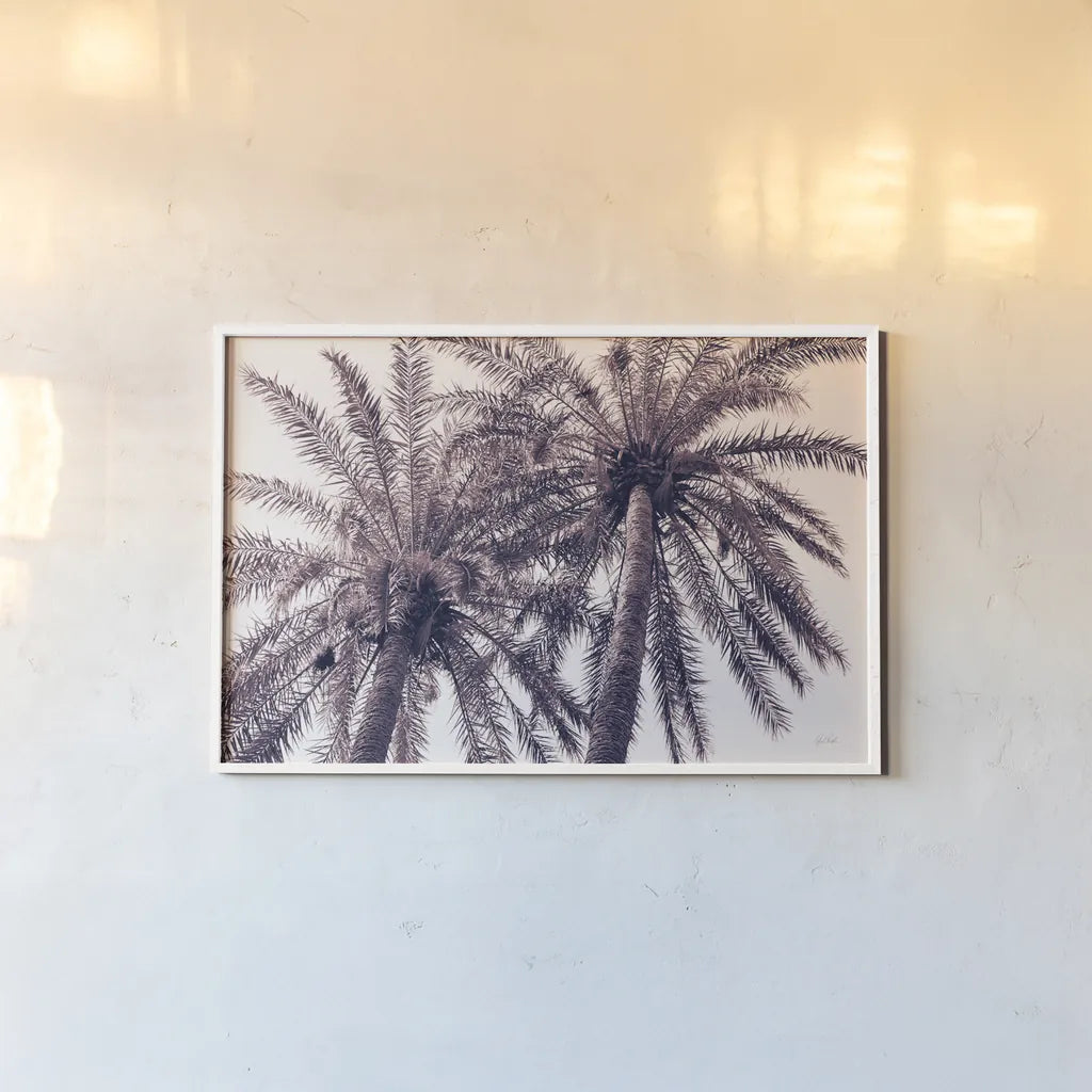 Pink Palms Horizontal by Deborah Revell. shown as a paper print in a white frame. Available as a archival giclee rolled canvas, fine art paper, or poster print. SKU 94378i.