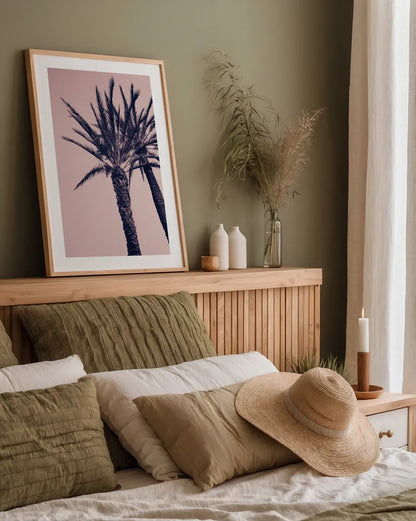 Pink Palms I by Deborah Revell. shown as a paper print in a natural frame. Available as a archival giclee rolled canvas, fine art paper, or poster print. SKU 94375h.