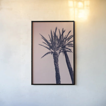 Pink Palms I by Deborah Revell. shown as a paper print in a black flame. Available as a archival giclee rolled canvas, fine art paper, or poster print. SKU 94375h.